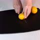 Woman cutting fresh lemons on the black board - VideoHive Item for Sale