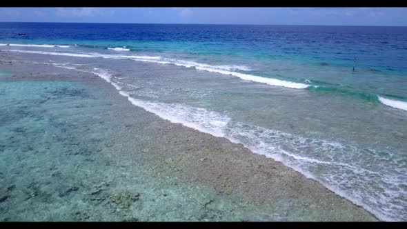 Aerial drone view abstract of relaxing coastline beach trip by shallow ocean and white sandy backgro