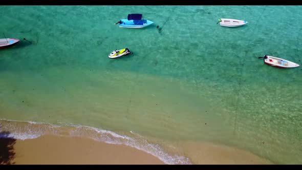 Aerial drone texture of luxury seashore beach lifestyle by shallow ocean with white sandy background