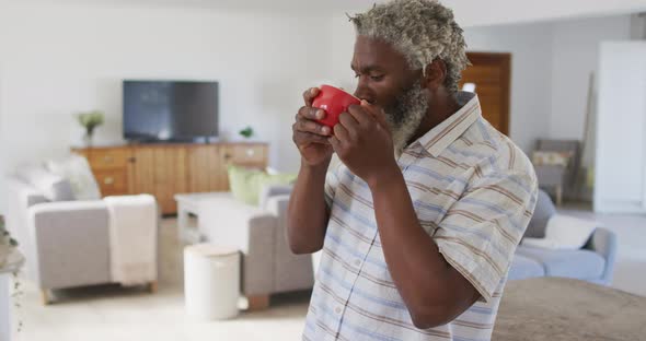 Senior man drinking coffee at home