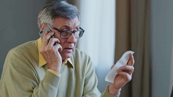 Close Up Retired Customer Complaining High Price Talking on Phone Portrait Disgruntled Elderly Man