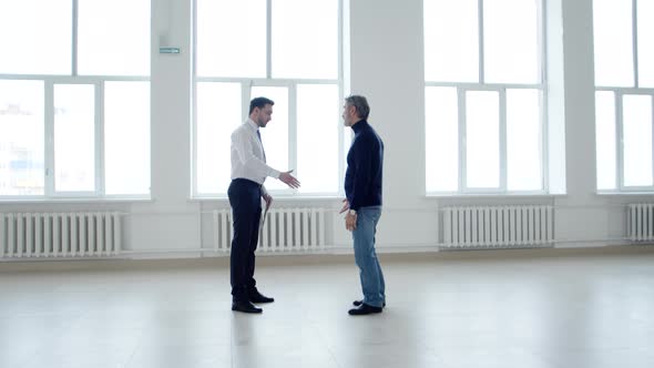 Businessman Shakes Hands with Realtor and Leaves After Discussing Lease Agreement for Office Space