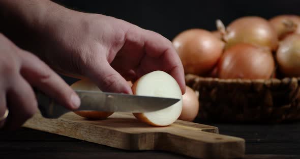 Hands Men Cut the Onions in Rings. 