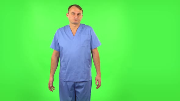 Upset Man Disappointed Looks at Camera and Shrugs. Green Screen