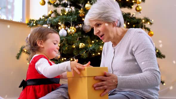 Grandmother and Baby Girl with Christmas Gifts