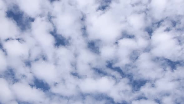 timelapse of clouds moving up in the sky. looking directly at the clouds in the sky.