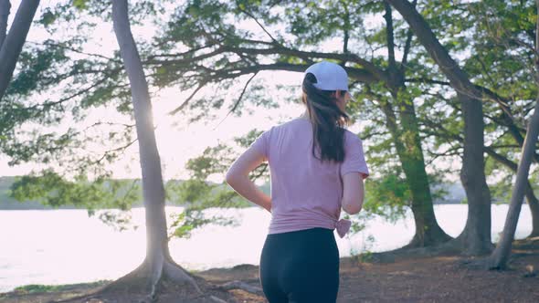 Asian young beautiful sport woman exercise by running workout on street in public park.