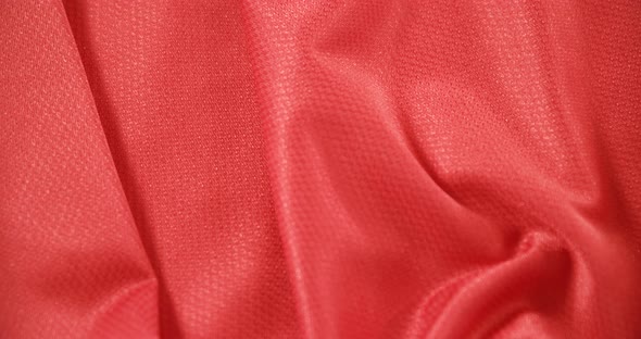 Close-up of football red jersey fabric 4k