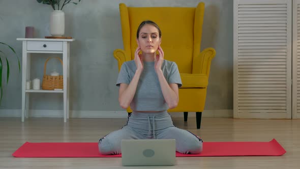 Woman meditates at home in the morning