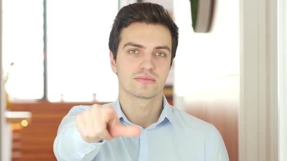 Man Pointing at Camera, Indoor