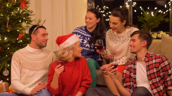 Friends Celebrating Christmas and Drinking Wine