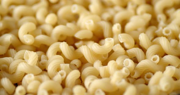 Cavatappi Pasta Dry Rotates Slowly on the Table