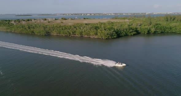 Aerial View Following a Speed Boat on St Lucie River