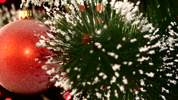 Unusual Decoration - a Round Shiny Red Toy on Christmas Tree, Bokeh, Light, Black, Garland