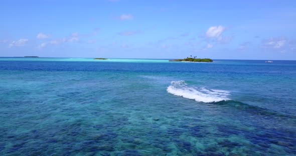 Tropical fly over abstract view of a white sandy paradise beach and turquoise sea background in high