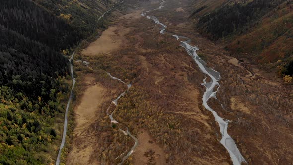 A Meandering River Flowing Through a Mountain Valley