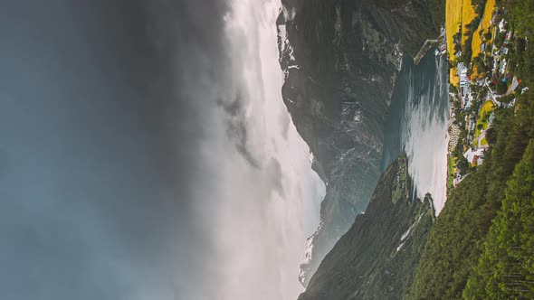 Vertical Pan Shot Geirangerfjord Norway  Geiranger In Geirangerfjorden In Sunny Summer Day