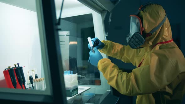 Man Works with Coronavirus Antibodies in Laboratory