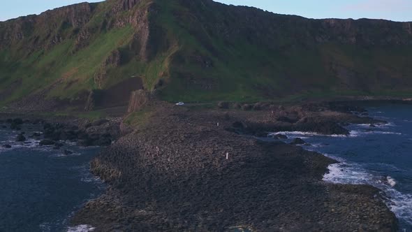 Giants Causeway on Antrim Coast of Northern Ireland. Aerial drone pull away