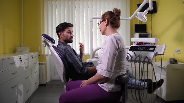 Man Patient Visiting Dentist in Stomatology Clinic