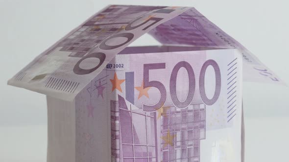 House made metaphor of European Union paper money 4K 21650p 30fps UltraHD tilting footage - Improvis