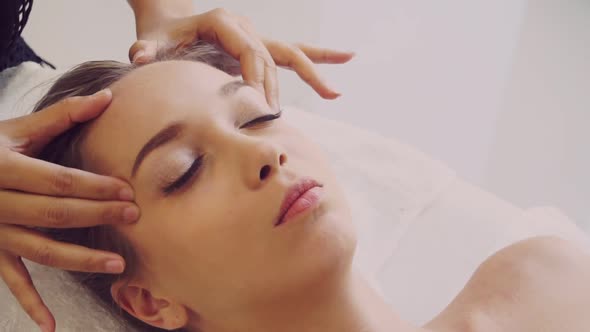 Woman Gets Facial and Head Massage in Luxury Spa