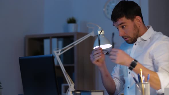 Businessman with Laptop Working at Night Office 35