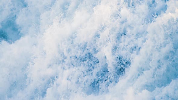 Waterfall close-up view slow motion texture making by water. Powerful Water cascades falling down.