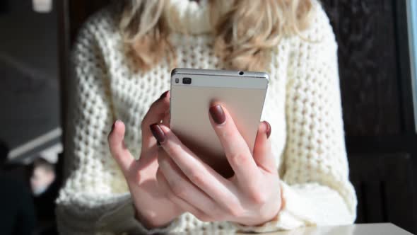 Woman's Hands Close Holding Smartphone