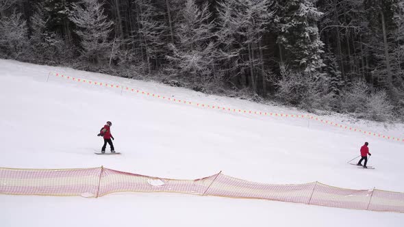 Skiing footage, skilled skier skiing on ski slope in long turns carving on sunny winter vacation