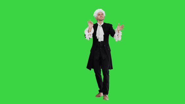 Man Dressed Like Mozart Conducting Expressively While Looking at Camera on a Green Screen, Chroma