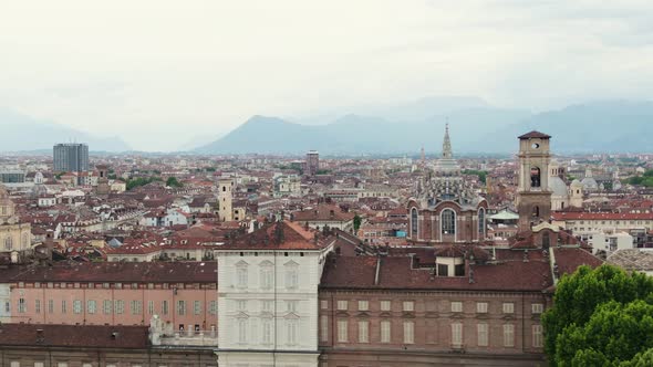 Beautiful cityscape and historical buildings of Turin, aerial ascend side flying view