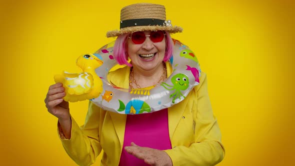 Senior Grandmother Traveler Tourist with Swimming Ring Ready for Vacation Journey Trip to Seaside