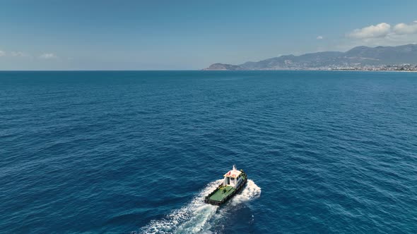 Tug boat sails in port aerial view 4 K Turkey Alanya