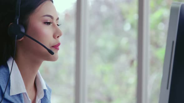 Customer Support Agent or Call Center with Headset Talking to Customer on Phone