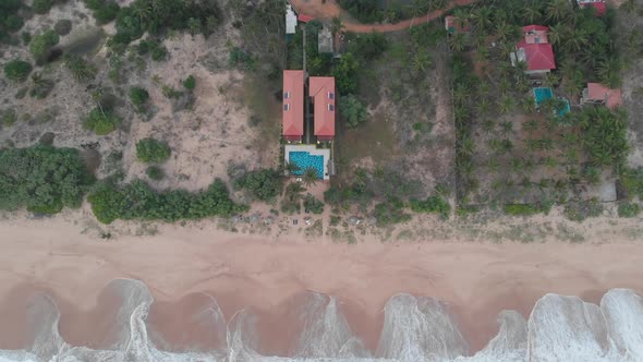 Kahanda modara beach in Sri Lanka. Top shot of a hostel in front of the sea