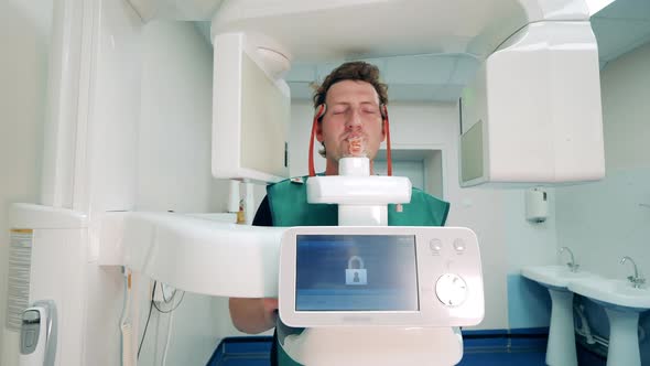 Xray Machine is Scanning Man's Oral Cavity