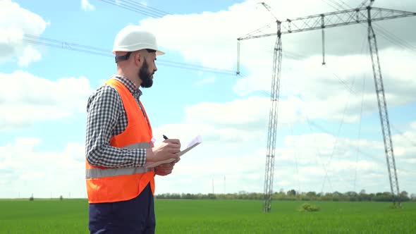 Engineer Working Near Transmission Lines