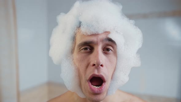 A Man in a Foam Wig Singing