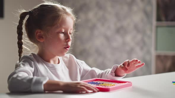 Little Girl Learns to Count By Abacus and Talks at Lesson