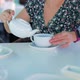 Woman Pour Tea in a White Cup - VideoHive Item for Sale