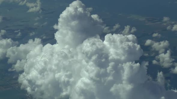 Flying above the clouds. Aerial footage (clear airplane cockpit view)