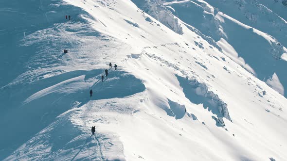 Climbers Walking Up Mountain Moving Towards the Peak  SnowCovered Landscape