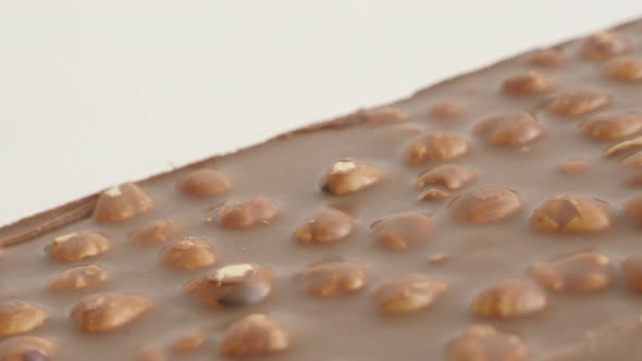 Whole hazelnuts milk chocolate 4K 2160p 30fps UltraHD footage - Slow pan on texture of tasty dessert