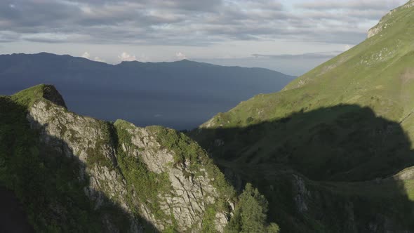 Aerial Backward View Picturesque Summer Nature Mountain Ridge Valley with Sun and Shadow Organic