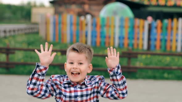 Cute Emotional Little Boy Jumping Outdoor