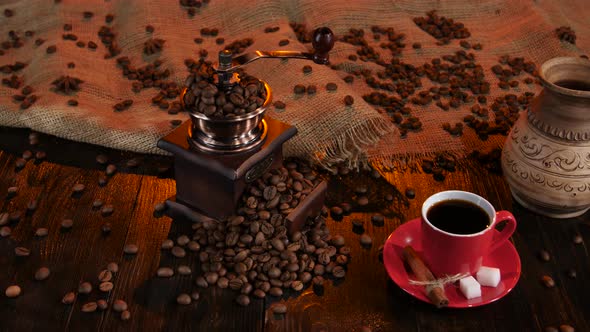 Red Cup with Coffee on Saucer with Pieces of Sugar