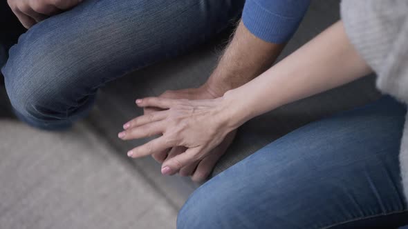 Top View Wife Touching Hand of Husband As Man Pushing Away Woman Palm