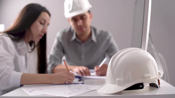 Two engineers working on the project.