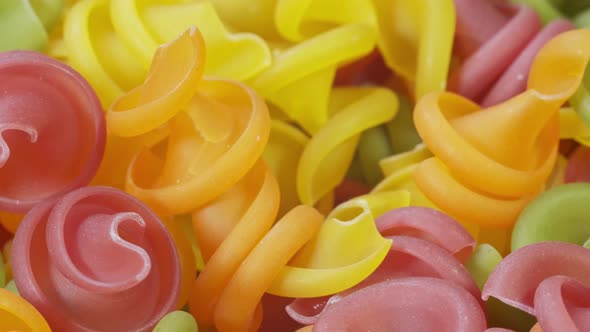 Multicolor Pasta on Textured Abstract Background.